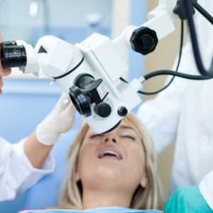 Dental microscope being used to look at a patient's teeth