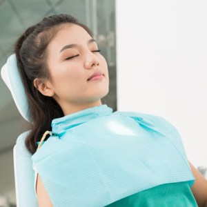 Patient sitting in a dental chair